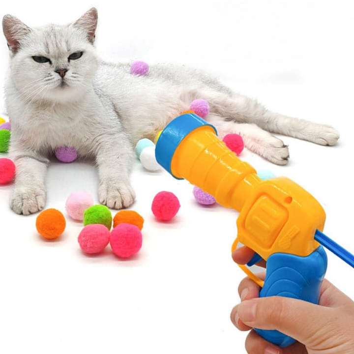 JUGUETE PISTOLA LANZA POMPOM + 20